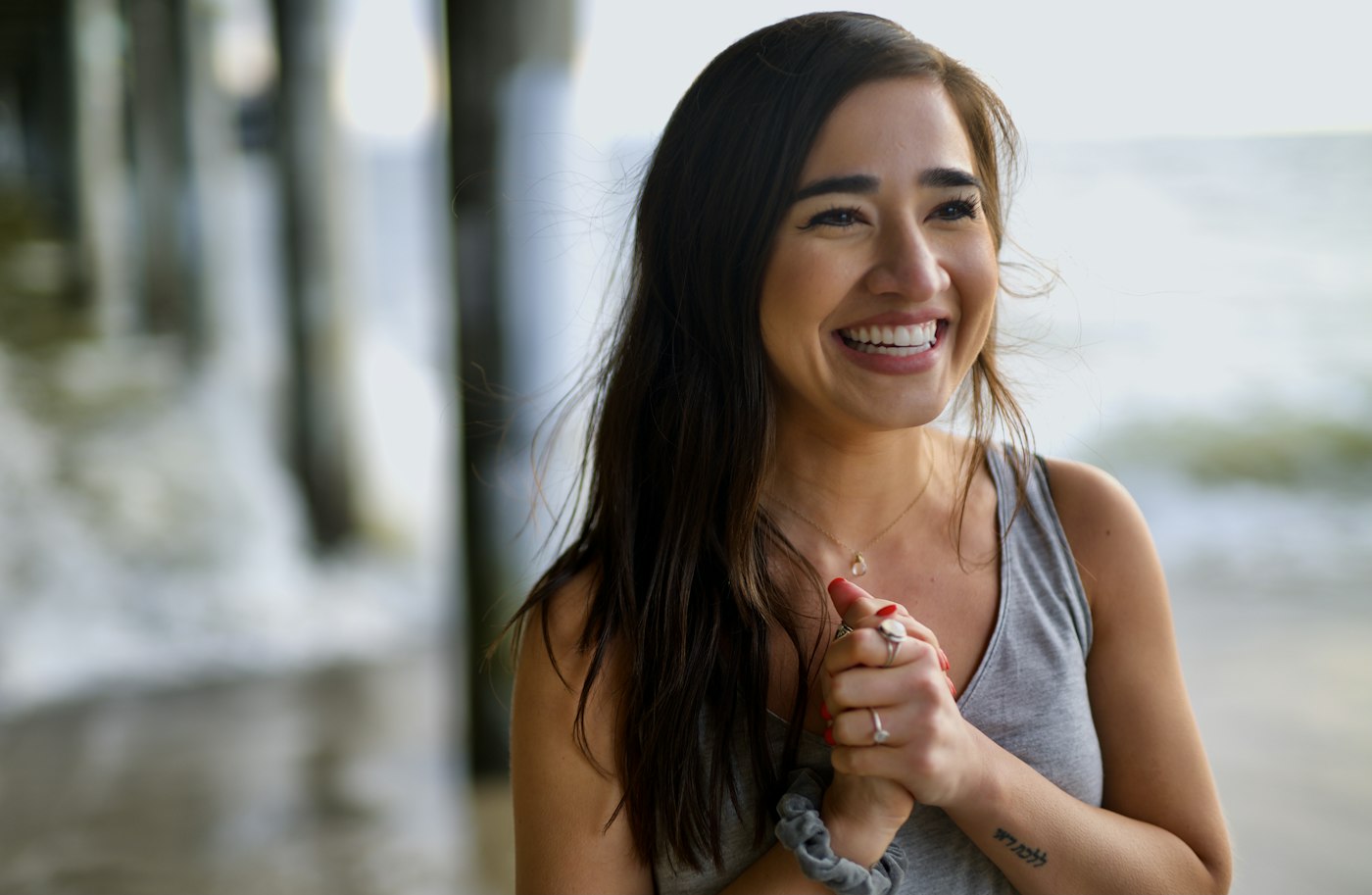 Woman smiling by the water