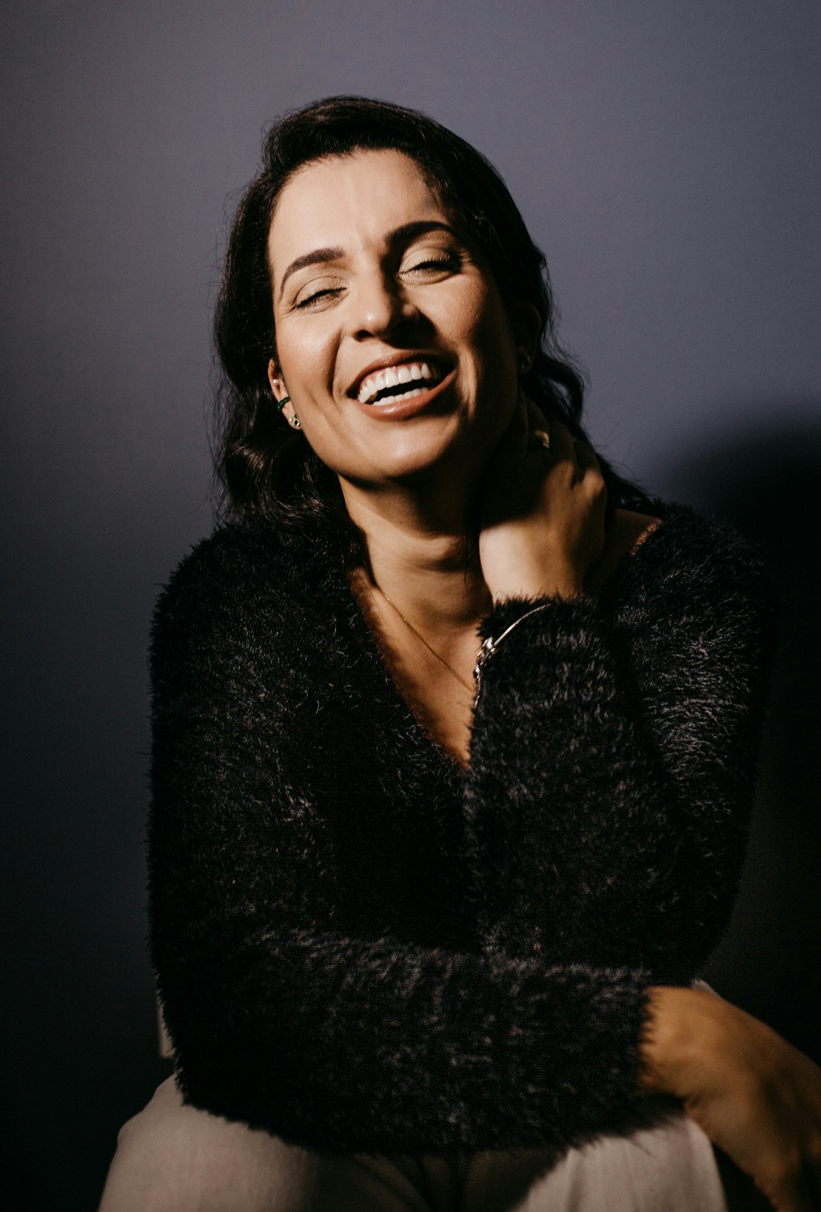 Woman in her forties laughing