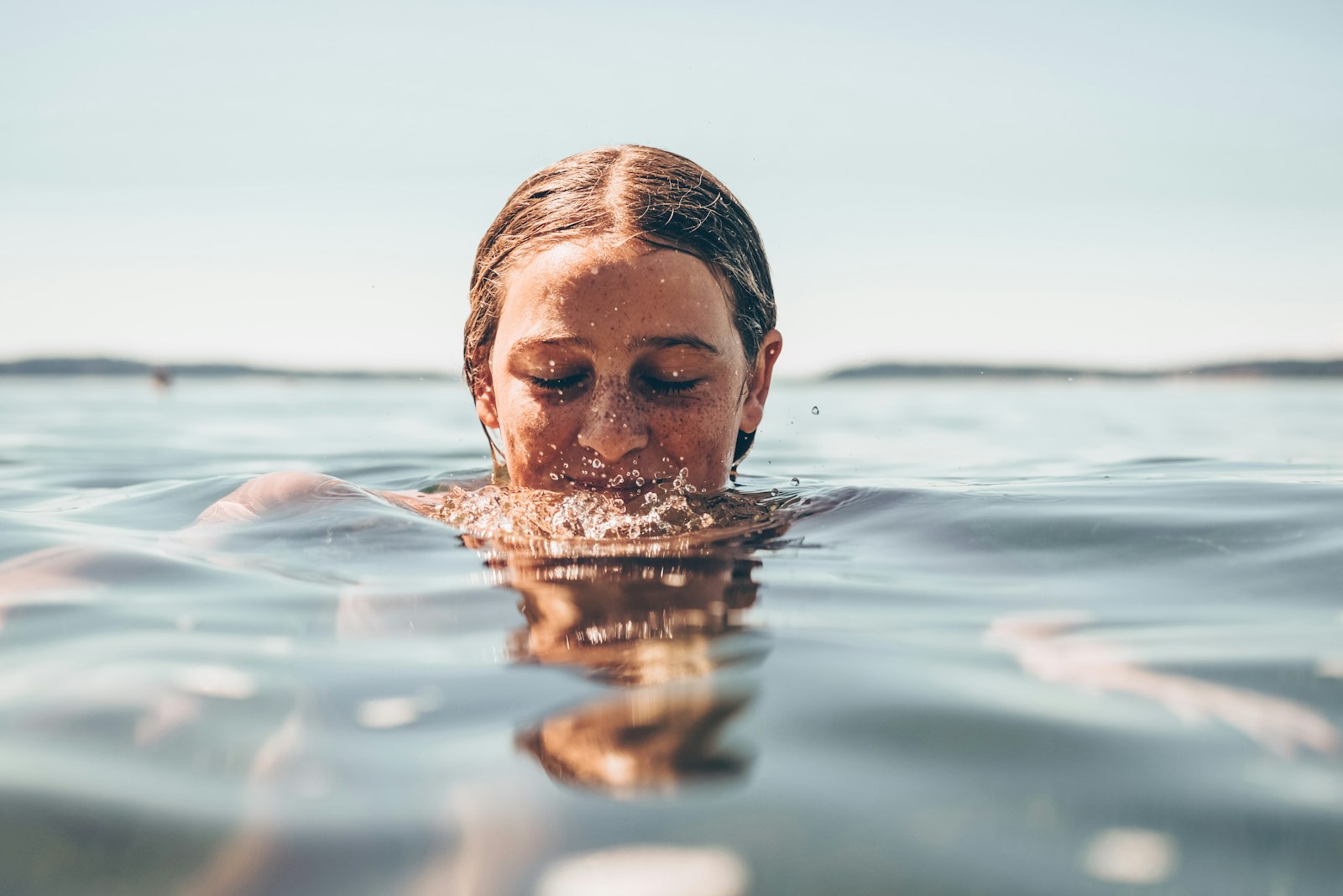 Woman swimming in open water